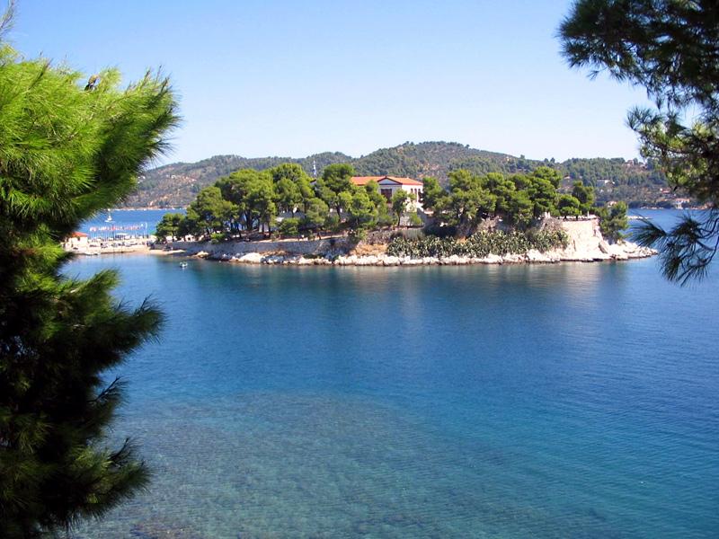 Skiathos town - view on Bourtzi, the wooded headland that separated the old port and the modern ferry port and marina.