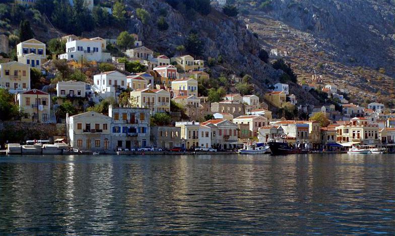 Simi or Symi island: One of the highlights on yacht charter sailing holidays in the Aegean - Dodecanese. Photo taken from our Beneteau Oceanis 440 yacht.